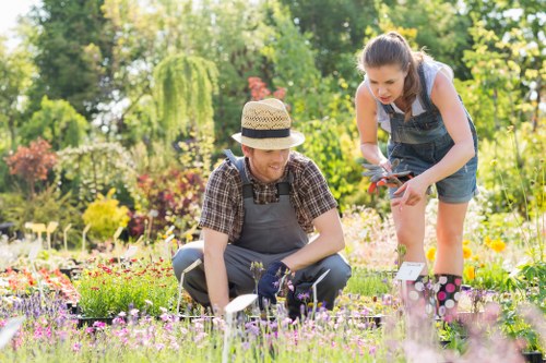 Gardeners in West Brompton caring for a well-kept urban garden