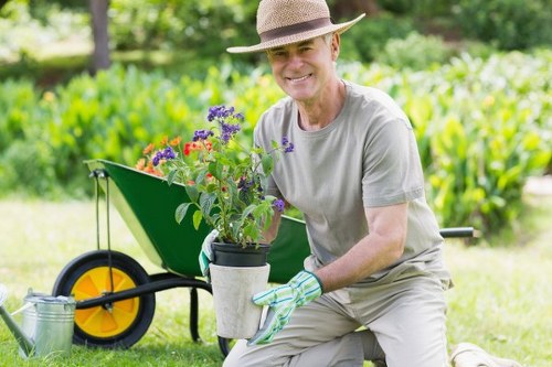 West Brompton garden maintenance service with healthy plants and clean hard landscaping